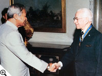 Thailand's Prime Minister Prem Tinsulanonda congratulates Herbert W. Armstrong for the royal Thai decoration conferred on behalf of Thailand's King Bhumibol.